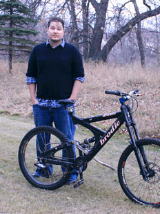 Michael G from Manitoba standing with his Broadie Diablo talks about using a Spiderflex seat riding aggressive downhill mountain biking trails in North Shore in North Vancouver, BC