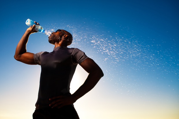 Man drinking Water from a water bottle